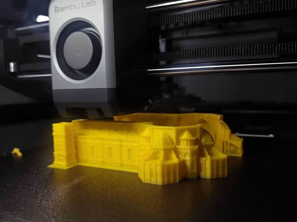 A part printing on the Bambu Lab P2S, nozzle mid-layer