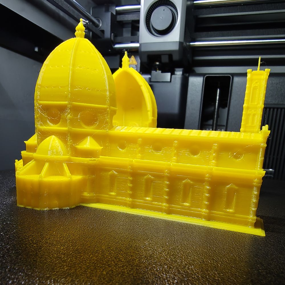 A yellow scale model of the Florence Duomo printed in PLA