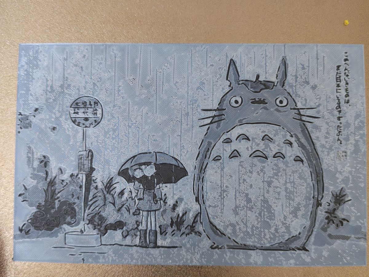 A Totoro lithophane panel printed in grey PLA
